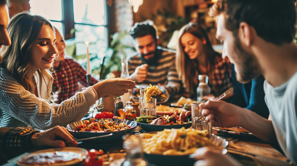 Joyful Group Of Pals Enjoying Pasta At A Home Gathering Happy Individuals Sharing A Meal Lifestyle Idea With Friends And Acquaintances Commemorating Turkey Day Vibrant Edit.